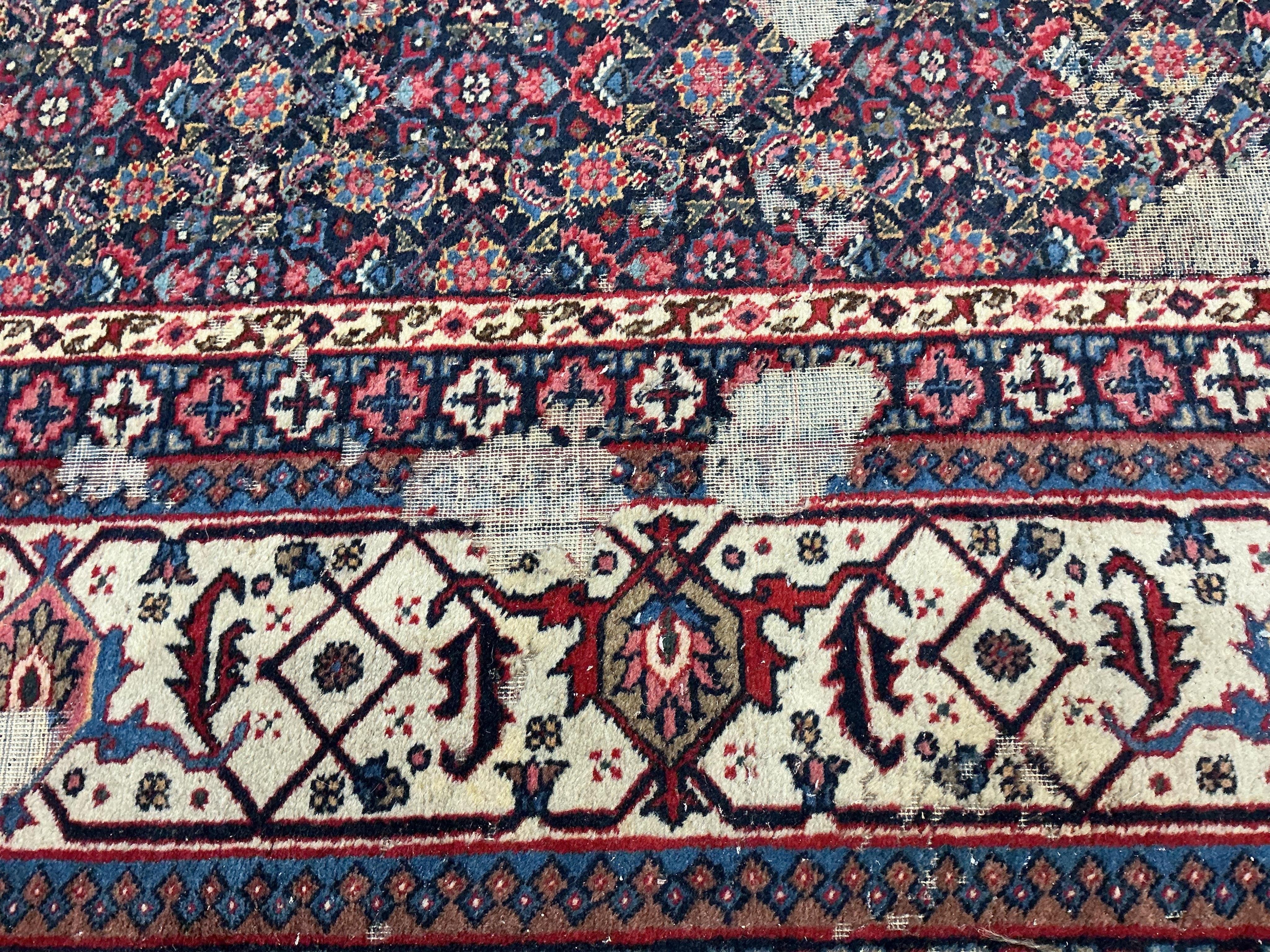 An early 20th century Tabriz blue ground floral carpet, moth damage, 440 x 340cm
